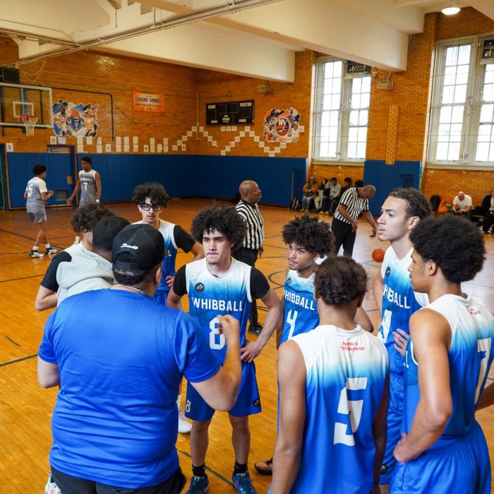 Basketball players about to start a basketball game
